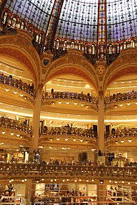 The glass cupola of the department store Galeries Lafayette (1912) provides light to the galleries below