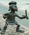 Image 15Statue of Minnie the Minx, a character from The Beano. Launched in 1938, the comic is known for its anarchic humour, with Dennis the Menace appearing on the cover. (from Children's literature)
