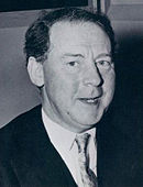Bust-length monochrome portrait photograph of Hugh Gaitskell in dark suit