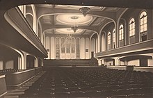black-and-white photograph of the interior of a large empty concert hall