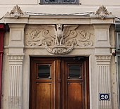A pair of pilasters flanking a door in Lyon (France)