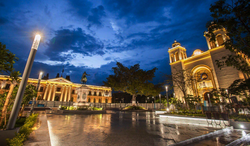Panoramic view from Plaza Gerardo Barrios with National Palace from the west, and the Metropolitan Cathedral from the north in the historic centre of San Salvador.