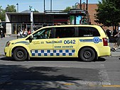 A Dodge Caravan EMS vehicle in Montreal, featuring white-and-blue Battenburg markings.