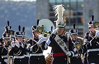 The West Point Band in marching formation led by the West Point Band drum-major.