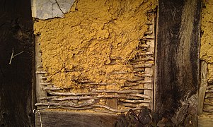 Half-timbered wall with wattle and daub infill. Some of the plaster coating survives. Rödinghausen, Germany.