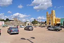 Central square of Acanceh, with pre-Columbian pyramid, Colonial church, and more modern structures