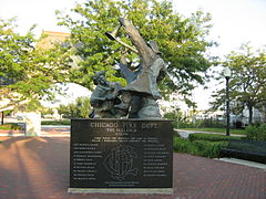 Memorial honoring firefighters fallen in the 1910 Stock Yard fire. Located directly behind The Gate