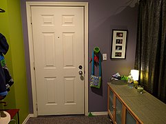 Entryway of an apartment in the United States, looking at the front door