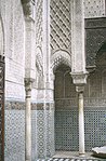 View of the small arches and blind arches (or niches) at the corners of the courtyard which are sculpted with muqarnas