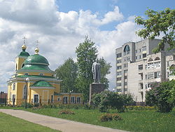 A monument to Lenin and an Orthodox church