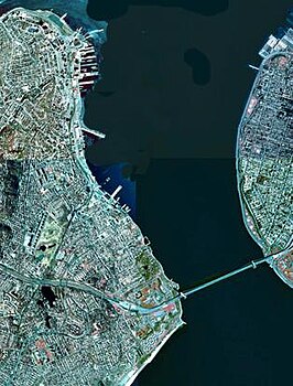 A satellite view of The Narrows with Staten Island (on the left) and Brooklyn (on the right) connected by the Verrazzano-Narrows Bridge