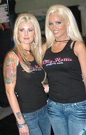 Heather Veitch and another JC's Girls member wearing JC's Girls "Holy Hottie" T-shirts at an erotic convention in Los Angeles in 2006