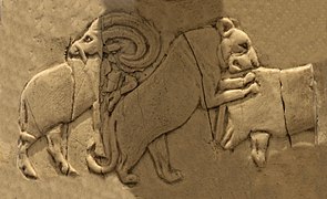 Lioness attacking a wild bull (Back, 4th register), another Mesopotamian motif.[34]
