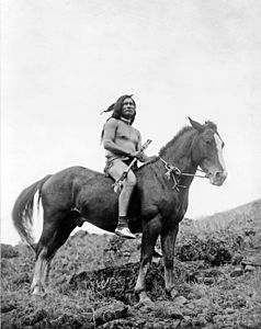 The old-time warrior: Nez Percé, c. 1910. Nez Percé man, wearing loin cloth and moccasins, on horseback.