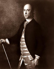 A black and white portrait of Christopher Gadsden, standing in civilian dress with a cane