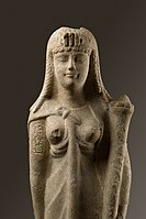 A marble statue of Cleopatra with her cartouche inscribed on the upper right arm and wearing a diadem with a triple uraeus, from the Metropolitan Museum of Art[456]