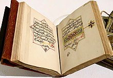 Photograph of a book, Dala'il al-Khayrat, opened to a middle page.