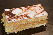 Traditionally, a mille-feuille pastry is made up of three layers of puff pastry, and two layers of crème pâtissière.