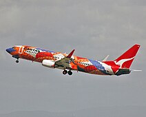 A Boeing 737-800 in 2005 wearing the Yananyi Dreaming livery, which drew on the work of internationally renowned Pitjantjatjara artist Rene Kulitja. The aircraft carried the colour scheme from 2002 to 2014.