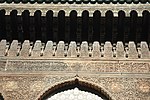 Details of the wood-carving along the top of the walls in the courtyard