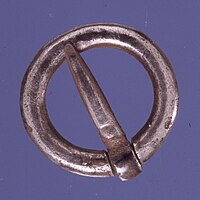 Plain silver medieval annular brooch; note that the pin cannot move along the ring