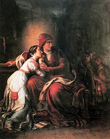 Middle-aged woman holding a young woman in her arms
