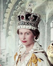 Queen wearing a crown festooned with pearls, diamonds, and other precious stones