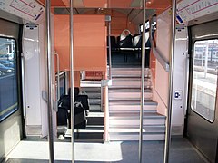 Interior, mid-deck showing stairs to upper and lower decks