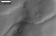 Image from previous photo of a curved ridge that may be an old stream that has become inverted. Image taken with HiRISE under the HiWish program.