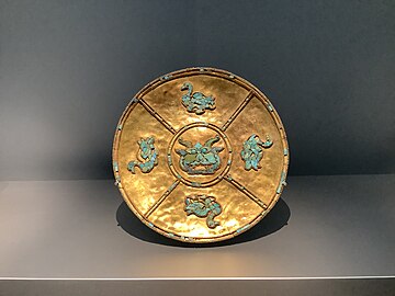 a gold and turquoise plate from the Yarlung Dynasty of Tibet (600-800 AD) in the Al Thani collection