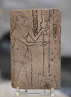 Plaque with a libation scene, found in loose ground around the graves. 2550-2250 BCE, Royal Cemetery at Ur.[49][50]