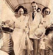 Tinted photo of a smiling Quezon, Aurora and their daughter Baby
