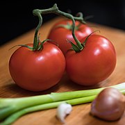 A close-up of tomatoes with selective focus and a shallow angle
