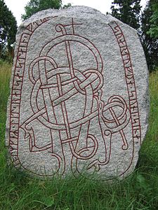 Uppland Runic Inscription 1014 with Viking interlaced animal, Uppland, Sweden, attributed to the runemaster Öpir, late 11th or early 12th century