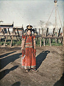 1913 photo of Mongol woman next to the Khais (hedge fence) of Zuun Khuree.
