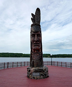 Nee-Gaw-Nee-Gaw-Bow (Leading Man), by Peter Wolf Toth (1988), to honor the Ojibwe people; it is located on the lakeside pier next to the Wakefield Visitor’s Center and was carved from one piece of pine donated by the Ottawa National Forest. It is one of Toth's Whispering Giants.