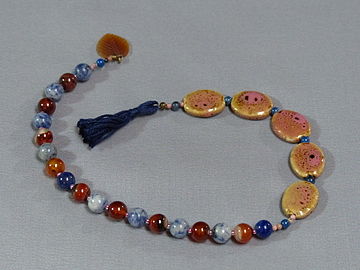 Baháʼí prayer beads in a 19 bead, 5 set counter configuration