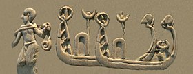 Shaven-headed man towing high-prowed boats, of a type seen on Sumerian Uruk period seals and artworks.[9] Possibly part of the depiction of a naval battle.[10][11][12] (Front, 3rd register)