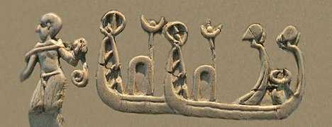 Shaven-headed man towing high-prowed boats, of a type seen on Sumerian Uruk period seals and artworks.[39] Possibly part of the depiction of a naval battle.[40][33][41] (Front, 3rd register)