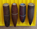 The first 3 of these rifle bullets have cannelures
