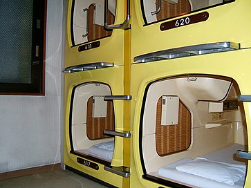 Stacked sleeping capsules, looks like enclosed bunk beds