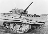 A stationary tank with a canvas skirt around the top of the hull