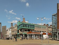 View from the town square De Deel on the Beursstraat (left) and the west-entrance of the shopping street Lange Nering, 2013