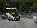 August 26th Loader-excavator with concrete pipe