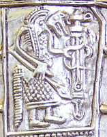 The 7th-century Gutenstein scabbard, found near Sigmaringen, Baden-Württemberg, Germany shows a warrior in wolf costume holding a ring-sword