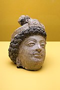 Head of a donator, polychromed stucco, Mes Aynak, 3rd-6th century CE