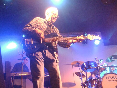 Jerry Scheff playing a bass guitar during a concert.