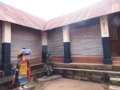 Central courtyard of the Yoruba styled old royal palace (Aafin Oba) of the rulers of Porto Novo featuring an Egungun and a post to Ogun