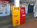 Express post box (yellow) and Australian Postal Corporation box (red) in Canberra, Australia