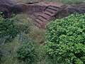 Rock-cut steps to a large cistern Pavurallakonda